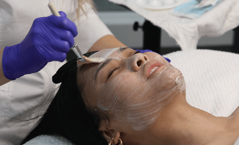 skin care specialist apply facial mask