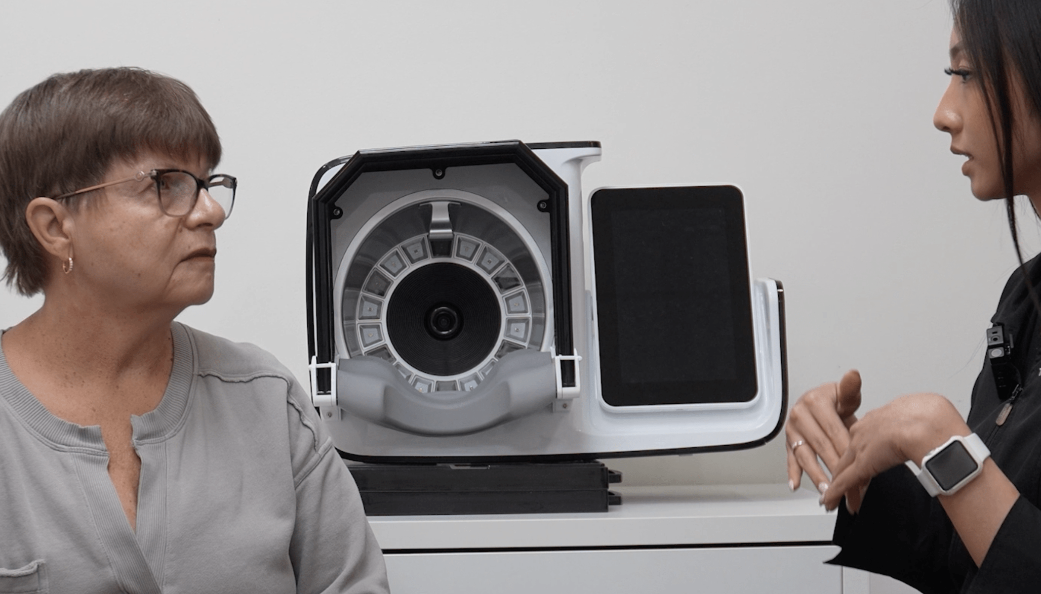esthetician explaining a treatment to a client