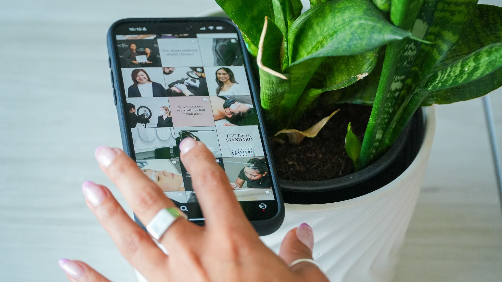 "An esthetician organizing a portfolio with sharp and professional images"