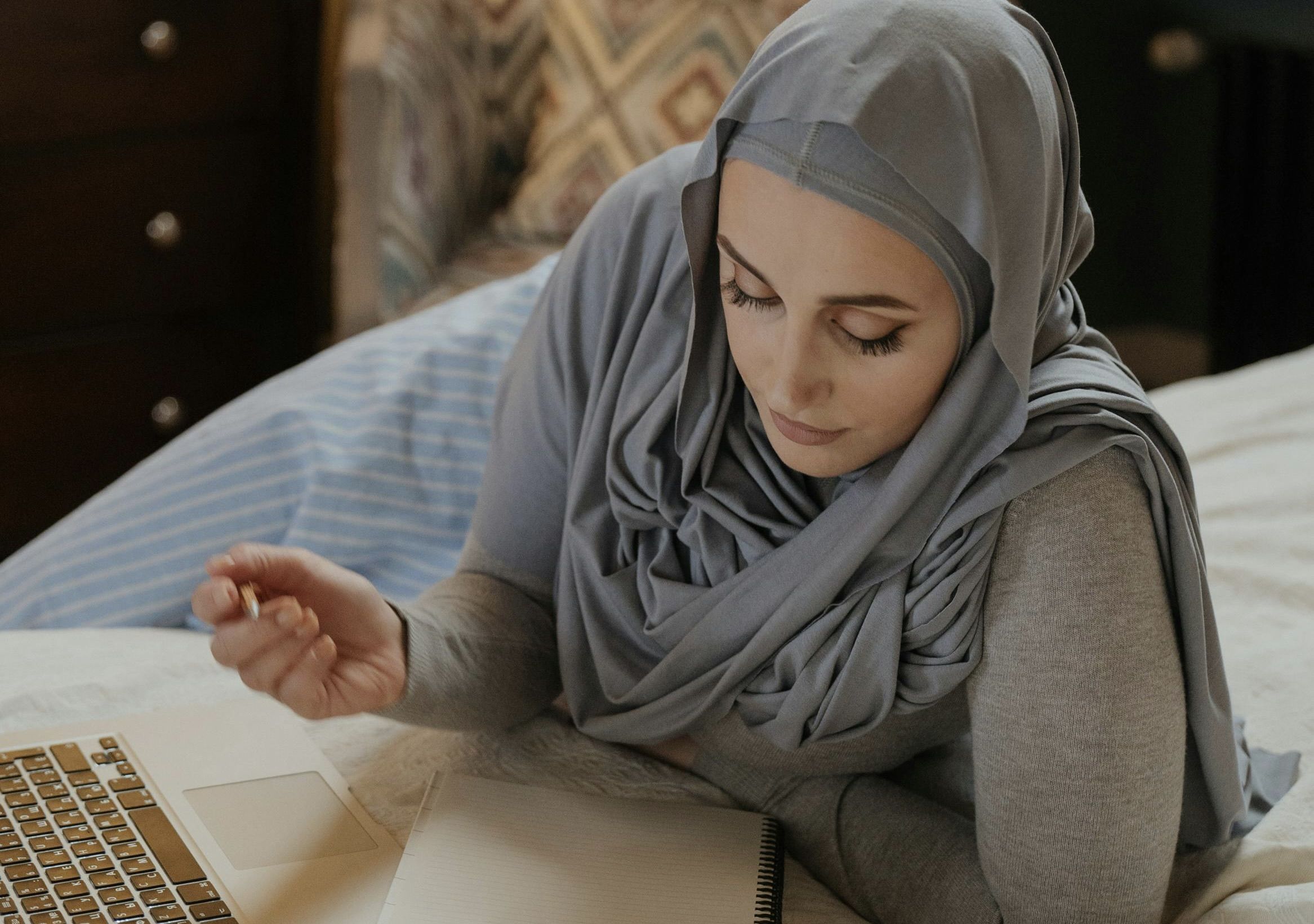 "Person engaged in online beauty school coursework "