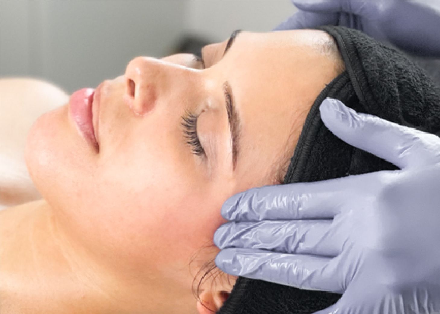 Model receiving facial massage at Wrapture Beauty Academy