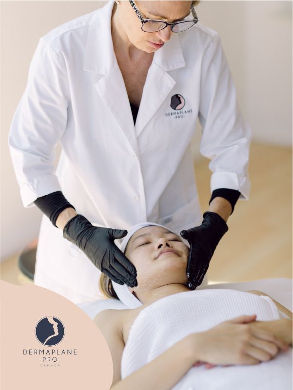 Esthetician performing facial treatment on client