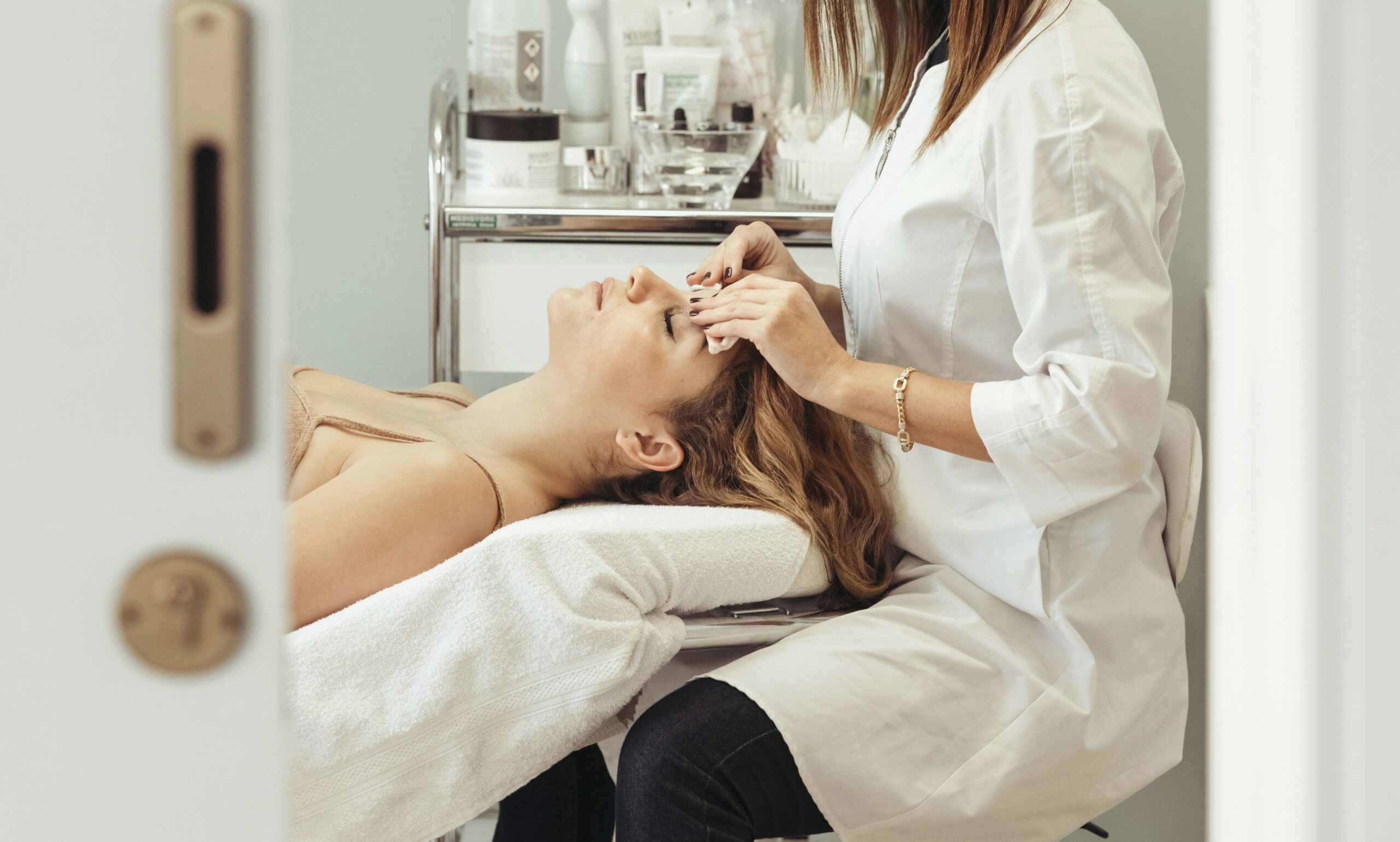 an esthetician performing a facial