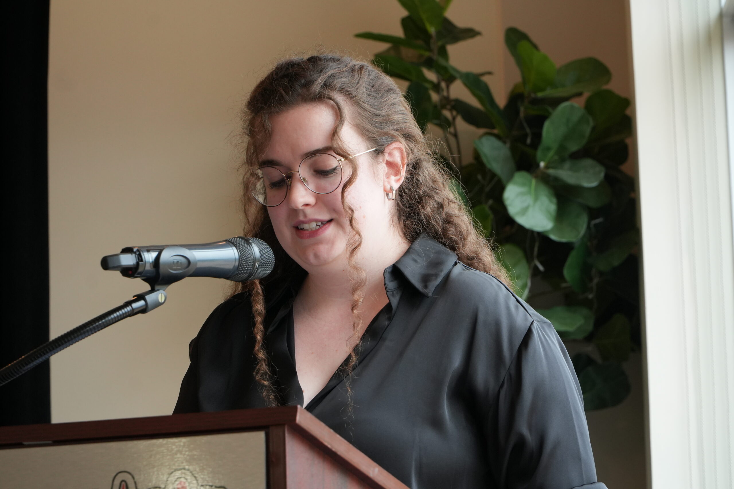 Graduate posing with faculty member at Wrapture Beauty Academy Winnipeg during their diploma ceremony.