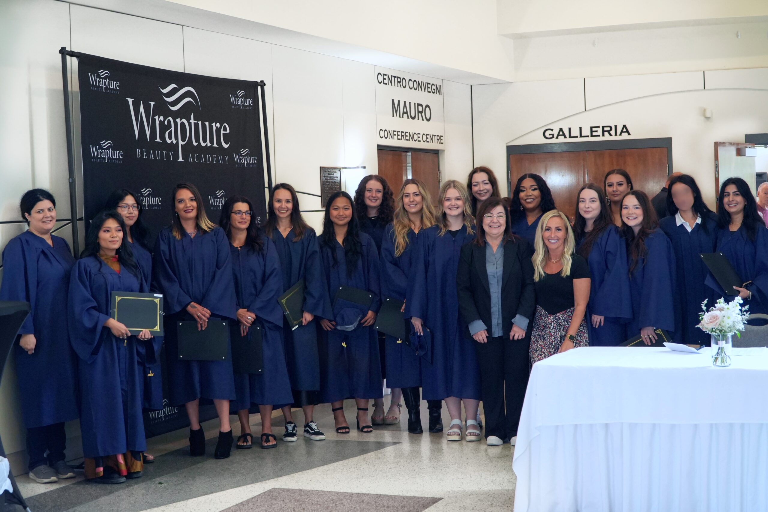 Faculty and graduates at Wrapture Beauty Academy Winnipeg, commemorating a milestone achievement in esthetics.