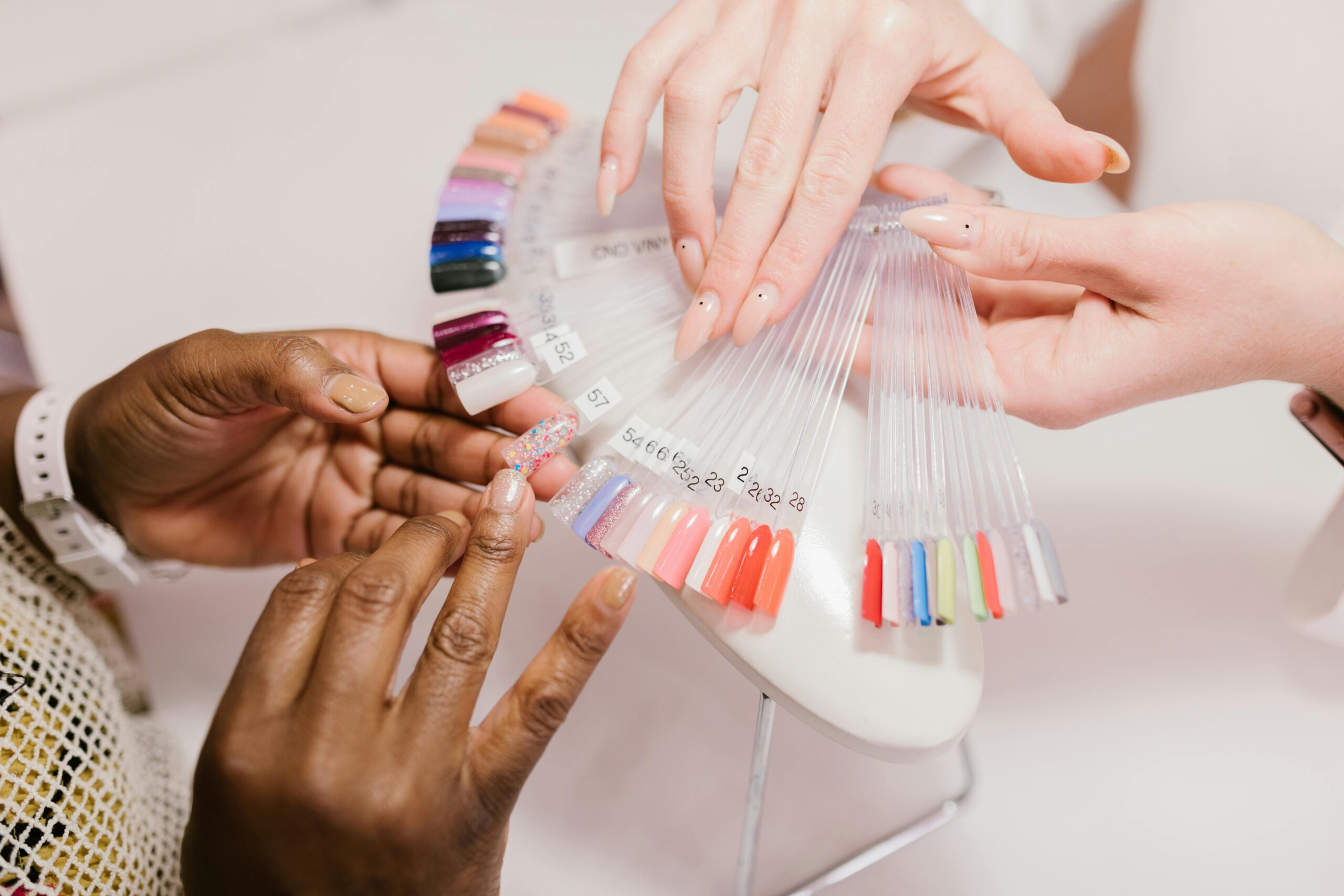 Client learning about additional spa treatments during a calming manicure.