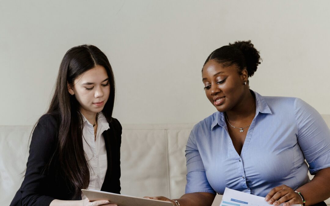 Laser technician connecting with a client and showing how laser triggers skin rejuvenation