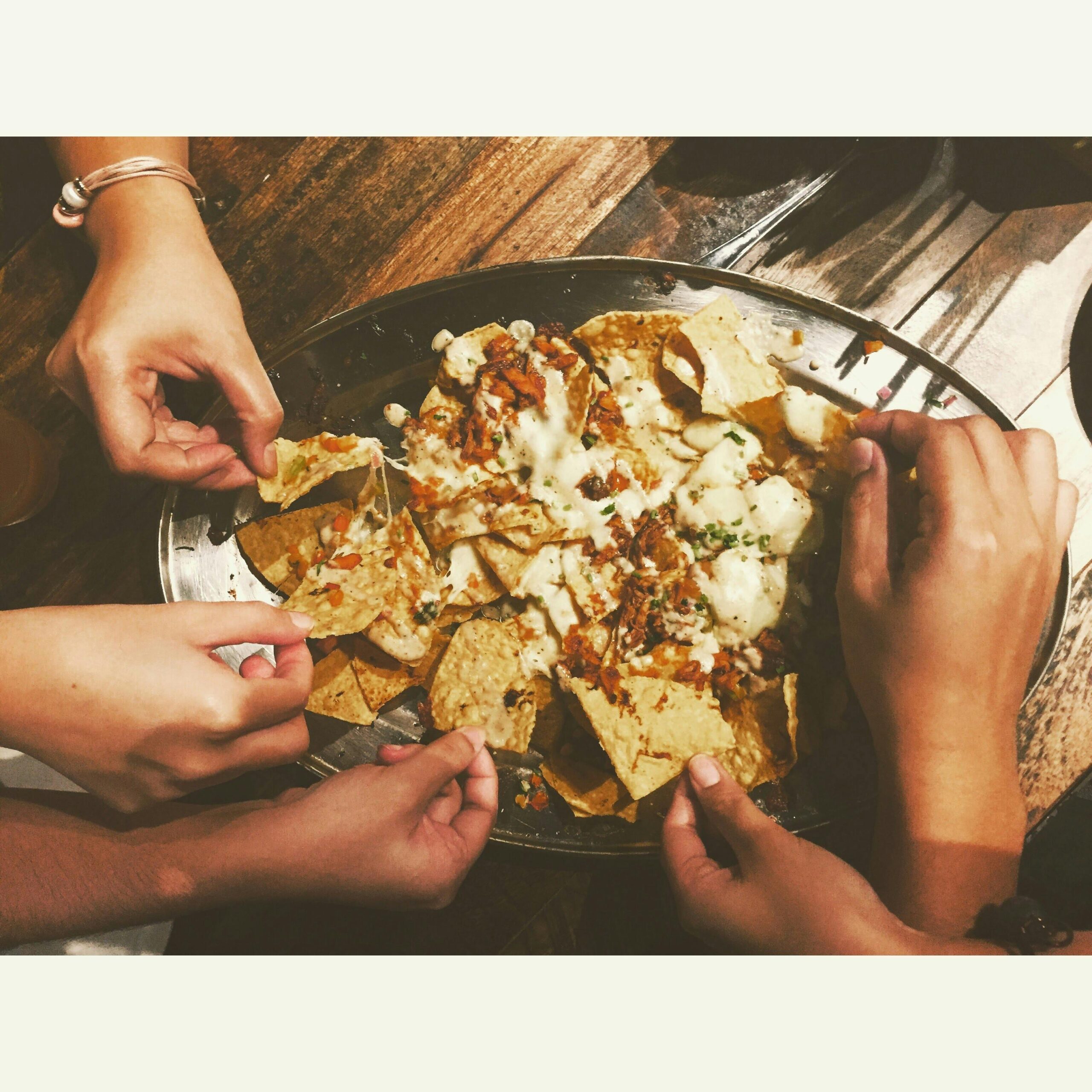 Galantines sharing nachos